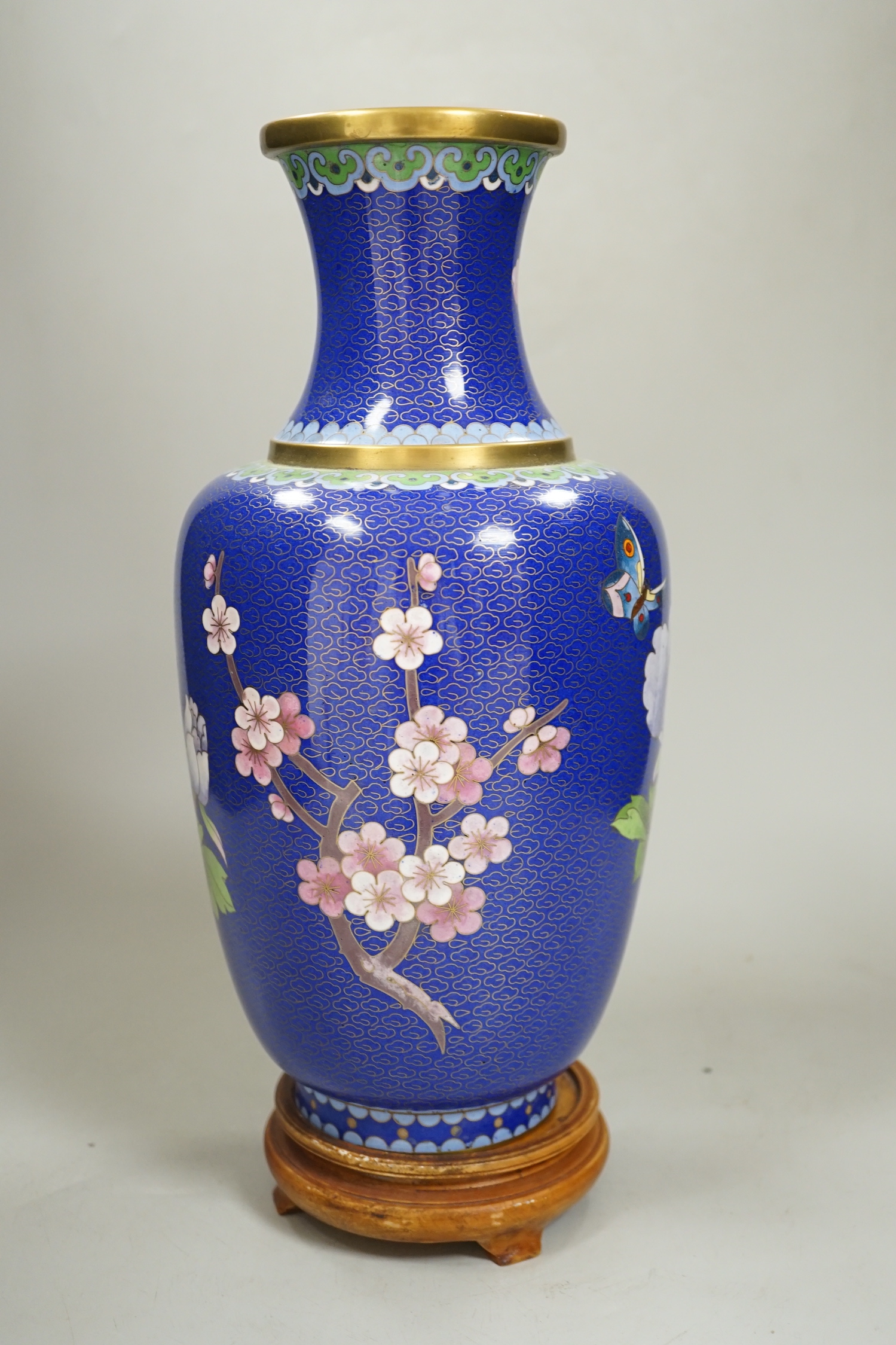 A Chinese cloisonné enamel vase on stand, 35cm high including stand